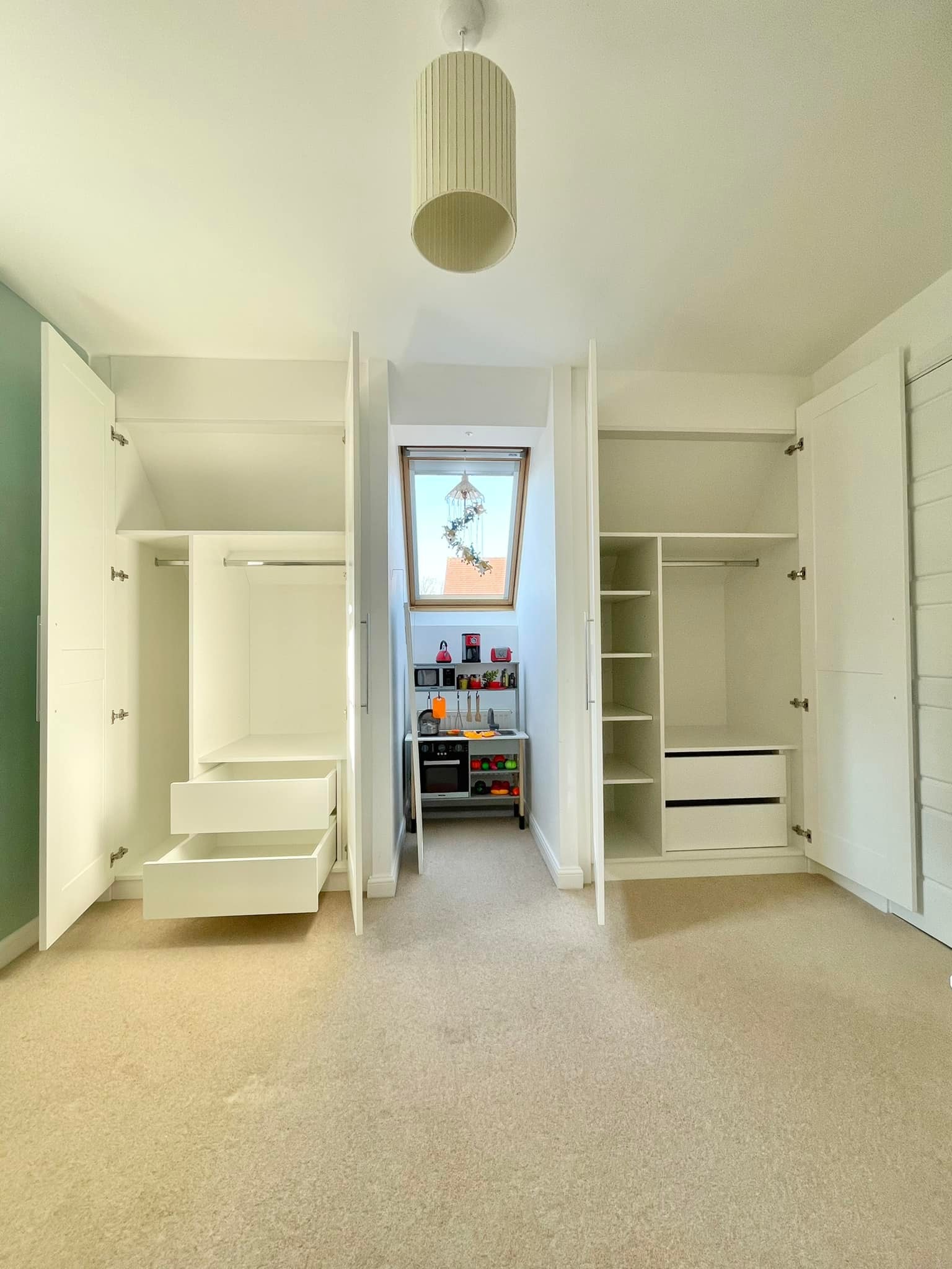 Interiors of two deep angled wardrobes 