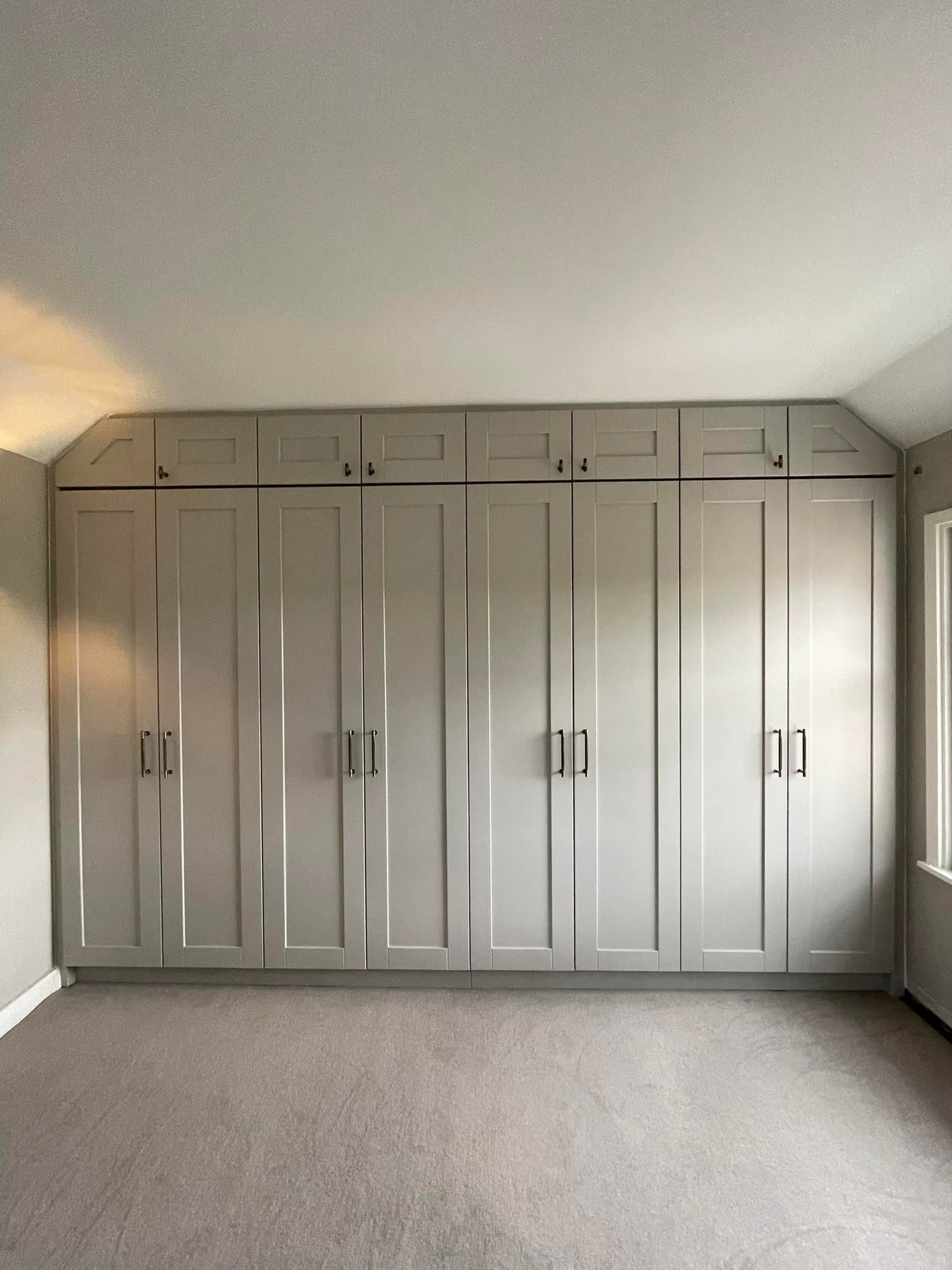 Fitted wardrobe six doubel doors in grey with top compartments 
