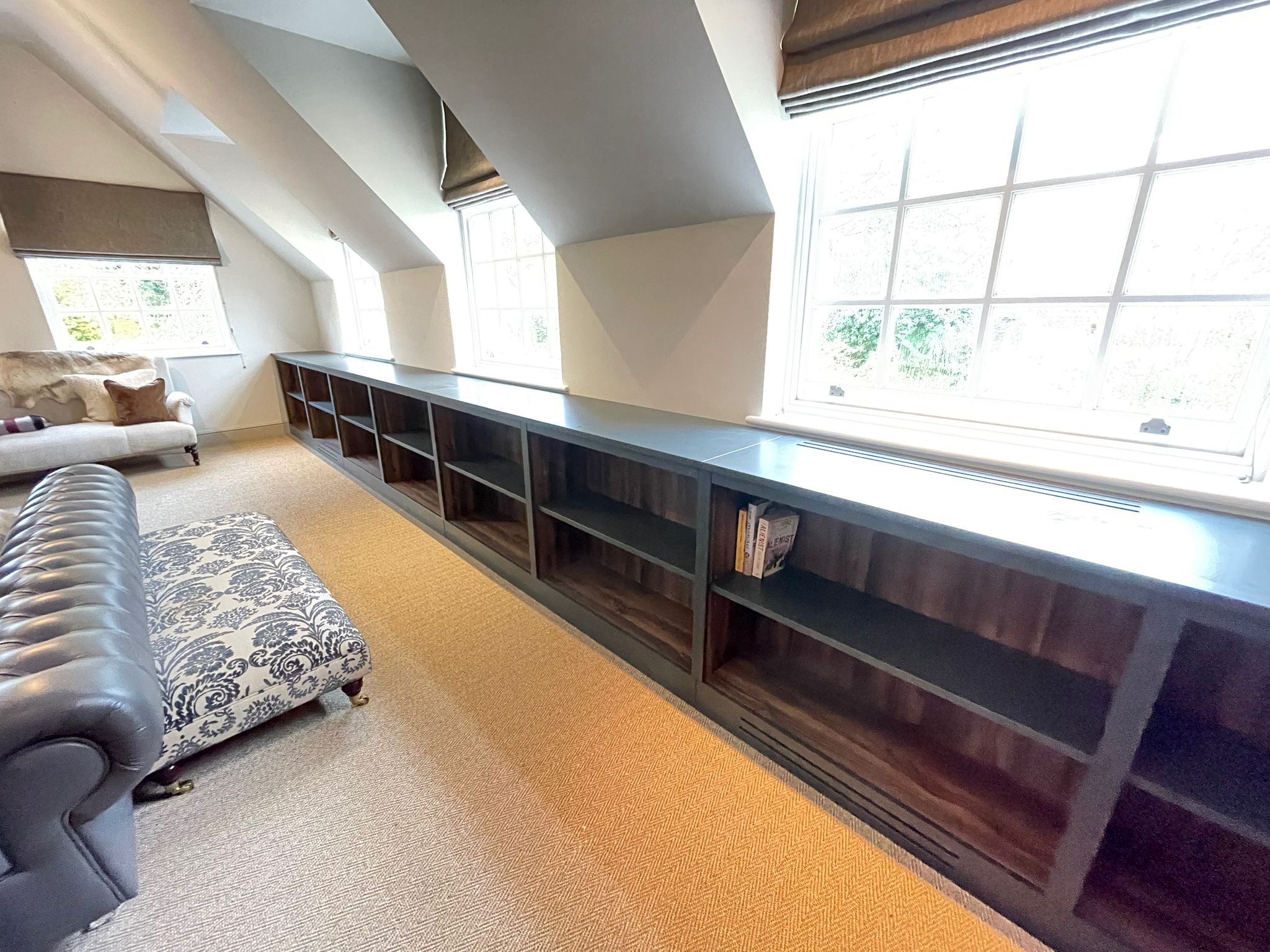 7.5 meter run of low built in bookshelf walnut interiors
